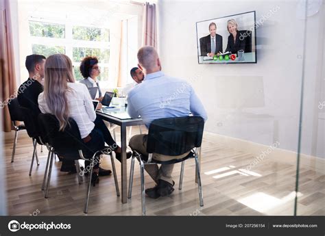 Group Diverse Businesspeople Looking Television While Video