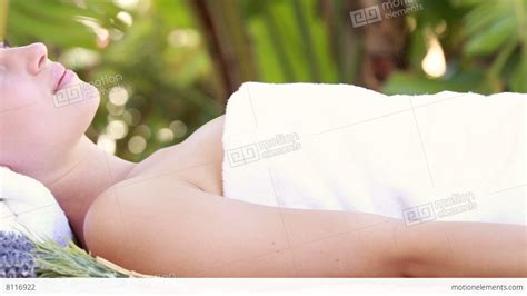 Woman Lying On Massage Table At Tropical Spa Stock Video Footage