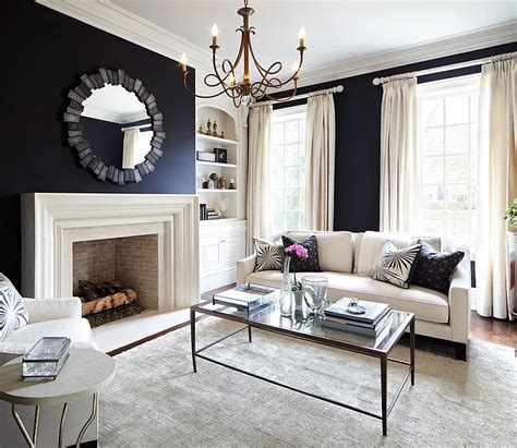 Dark walls accentuate color more than white ever would, so despite their deeper hue, shades like dark grey and navy blue work wonderfully in a colorful living room scheme. Black And White Living Rooms Design Ideas