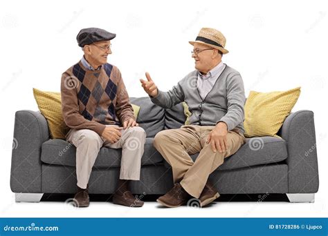 Two Elderly Men Sitting On A Sofa And Talking Stock Photo Image Of