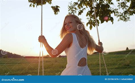 Lens Flareclose Up Joyful Lady Looking Back On Her Swing On A Sunny