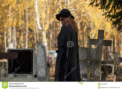 Widow Looking At The Gravestone Stock Images Image 34799384