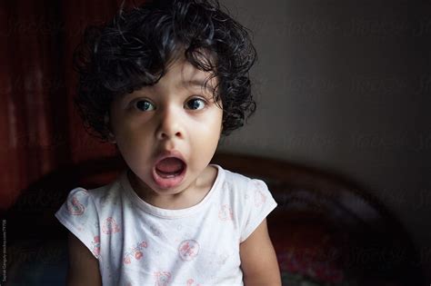 Cute Babe Girl Looking In Amazement With Open Mouth By Stocksy Contributor Saptak Ganguly