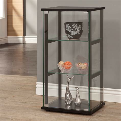 A curio cabinet is a specialised type of display case, made predominantly of glass with a metal or wood framework, for presenting collections of curios, like figurines or other interesting objects that invoke curiosity, and perhaps share a common theme. Knick Knack Curio Cabinet Black Four Sided Glass Display ...