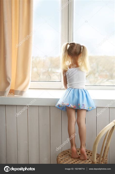 Girl Standing Near Window Stock Photo By ©belchonock 152166714