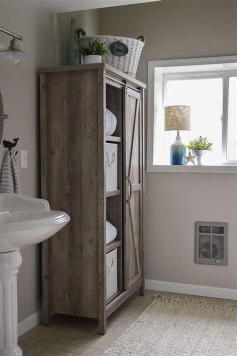 I absolutely love how the bathroom below uses the doodled wallpaper about the subway tile. The Little Cottage Bathroom Makeover - Fox Hollow Cottage