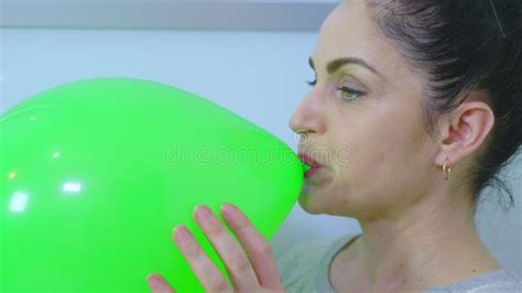 Woman Blowing Up Green Balloon Close Up Stock Footage Video Of Happy Blowercelebration 197802952