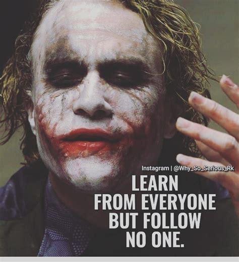 The Joker Is Holding His Hand Up To His Face With Words Written On It