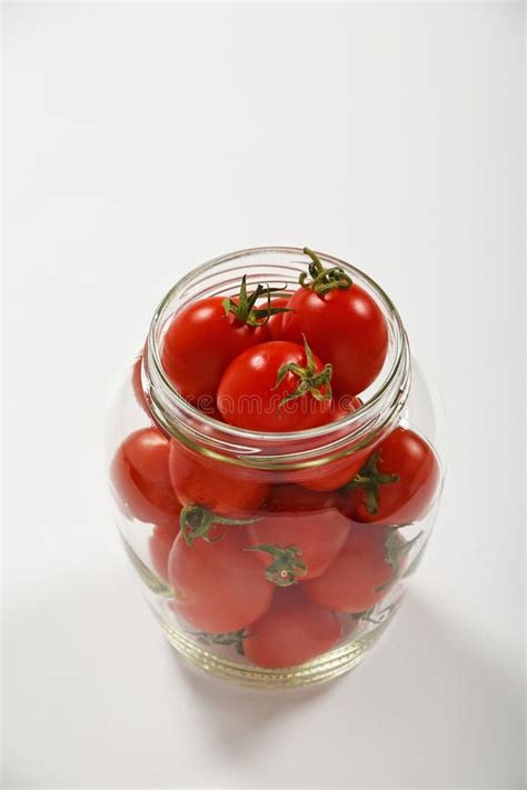 Cherry Tomatoes In Glass Jar Over White Stock Photo Image Of High