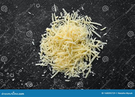 Grated Hard Cheese On A Black Stone Background Parmesan Stock Image