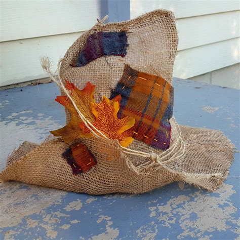 I had the flannel shirt, boots and floppy hat so just purchased a roll of raffia ribbon at michaels… Finally have the patchwork version of the burlap, scarecrow hat ready! Order one today ...