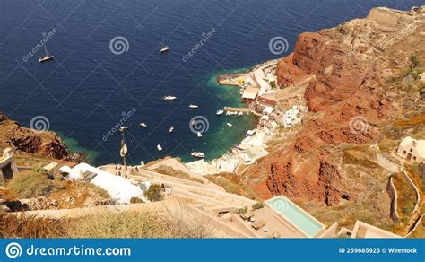 Aerial Of The Greek Amoudi Bay With Boats By Its Coastline Surrounded