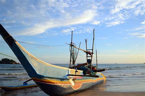 Traditional Fishing Boat Of Sri Lankan Fishermen Moored On The Beach Of