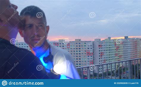 Same Sex People Portrait Of Two Gay Men On Balcony At Night Stock Image Image Of