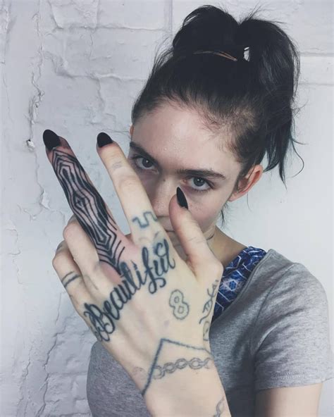 grimes ⚔️🎶⚔️ tattoos hand tattoos claire boucher