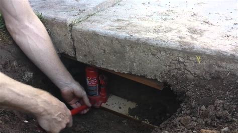 Then make sure everything is levelled out equally. Lifting a Sunken Concrete Driveway Slab DIY | FunnyDog.TV