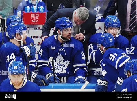 Toronto Maple Leafs Coach Sheldon Keefe Speaks To Auston Matthews On The Bench During The Third
