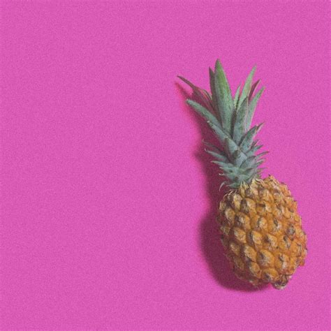 A Single Pineapple On A Pink Background