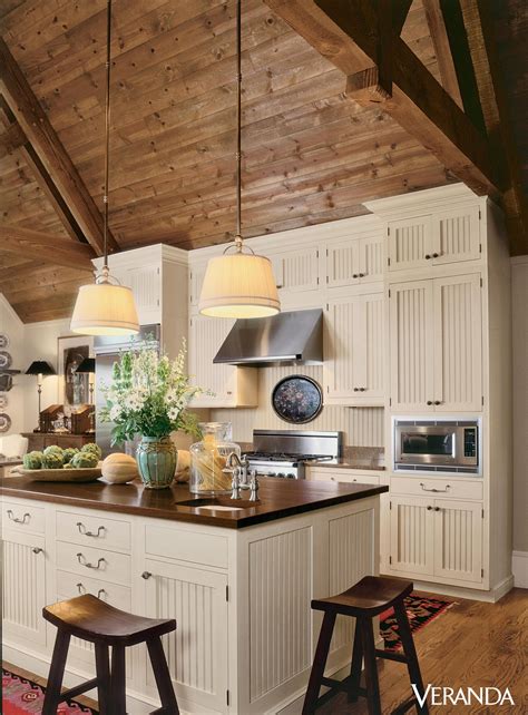 This Rustic Kitchen Features A Sloped Wooden Ceiling Leading To