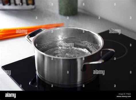 Boiling Water In Pan On Electric Stove In The Kitchen Stock Photo Alamy