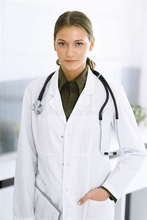 Woman Doctor Standing And Looking At Camera Perfect Medical Service In