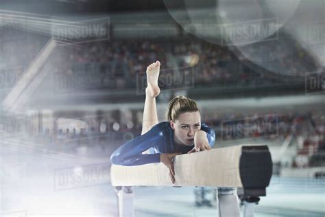 Female Gymnast Practicing On Balance Beam In Arena Stock Photo Dissolve