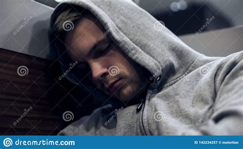 Homeless Man In Hoodie Sleeping In Public Transport Unemployment