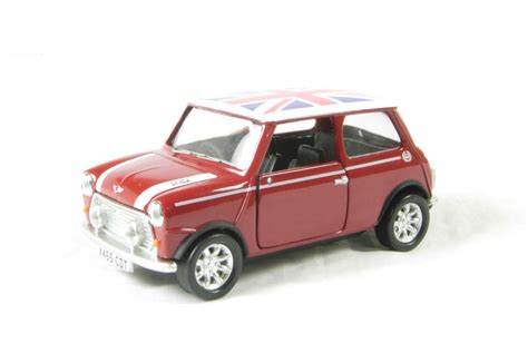 Raise your vehicle with a jack. hattons.co.uk - Corgi Collectables CC82262 Mini Cooper in flame red with 'Union Jack' roof