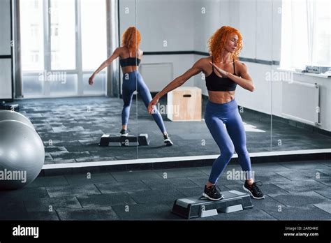 Exercise For Legs Sporty Redhead Girl Have Fitness Day In Gym At Daytime Muscular Body Type