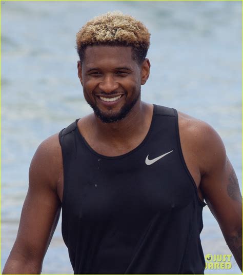 Full Sized Photo Of Usher Stays Clothed While Paddle Boarding Goes