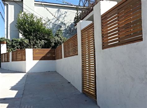 We also carry wrought iron door toppers in classic, elegant styles to embellish the area above your door. Wall Toppers & Privacy Fence — Harwell Design - Fences ...