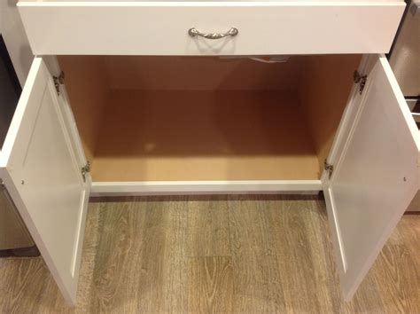 White cabinetry is a classic choice for a kitchen. Base cabinet with no center stile for maximum storage ...