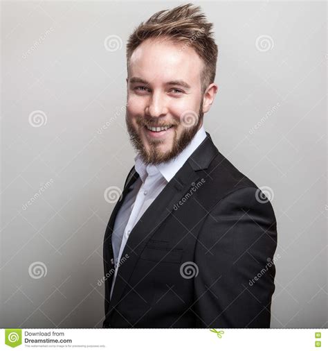 Elegant Young Handsome Bearded Man In Classic Black Costume And White