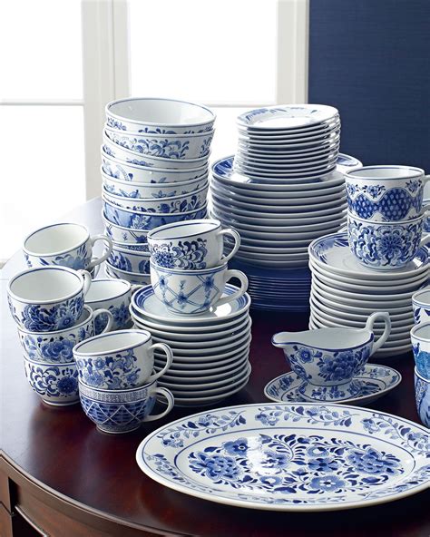 A Table Topped With Lots Of Blue And White Dishes