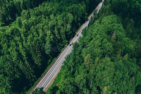 Aerial Drone View Of Green Forest With Country Road Stock Photo Image