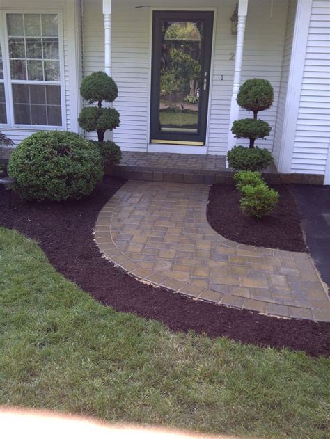 No walkway idea is complete without landscaping to accent its borders. Front walkway | Country garden decor, Brick columns ...
