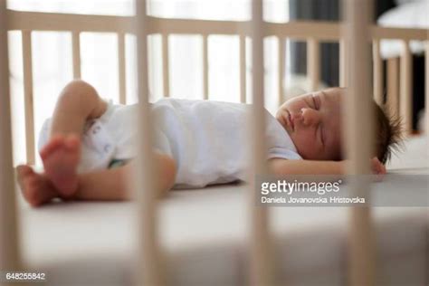 Baby Sleeping In Crib Photos And Premium High Res Pictures Getty Images