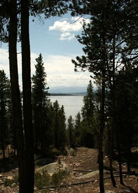 Through The Trees Turqoise Lake And The Mountains Seen Thr Flickr