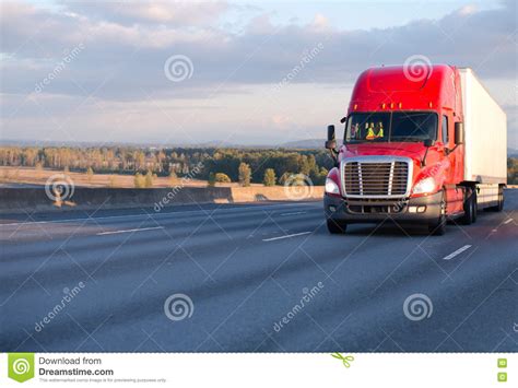 Big Rig Red Semi Truck Moving With Trailer On Wide Highway Stock Image