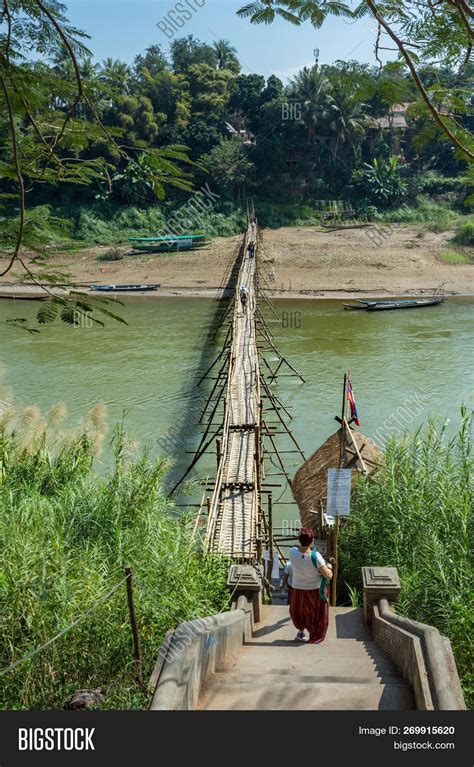 Bamboo Bridge Over The Nam Kahn River Near Its Confluence With The