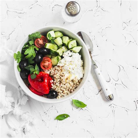 Mediterranean Quinoa Bowl With Avocado Cucumbers Olives Roasted