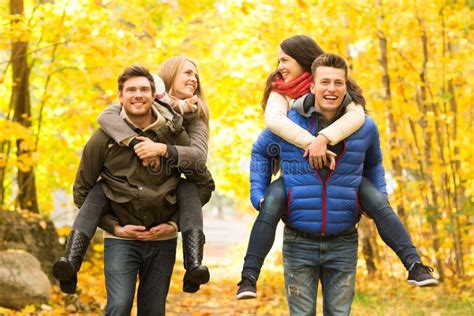 Smiling Friends Having Fun In Autumn Park Stock Photo Image Of