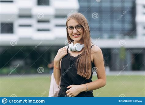 Portrait Of Young Stylish Woman Wearing Trendy Sunglasses Smiling And
