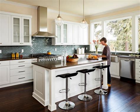 The white cabinets, walls, and subway tile backsplash keep the room feeling bright and open while the wood floor warms up the atmosphere with reflected this gorgeous contemporary kitchen utilizes dark granite counter tops and wood flooring to break up the use of bright white. Dark Kitchen Floors - Dark Floor Ideas — Eatwell101