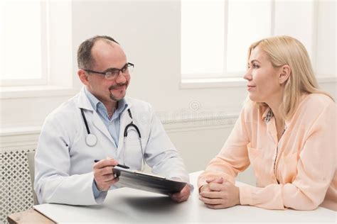 Doctor Consulting Woman In Hospital Stock Photo Image Of Prescription