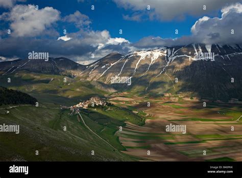 The Village Of Castelluccio And The Piano Grande With The Mountains Of