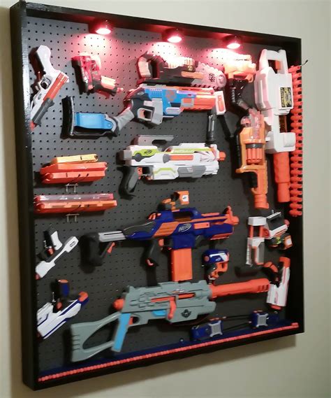 Used various hooks, wood screws, and nails to mount the guns. Pin on NERF WALL