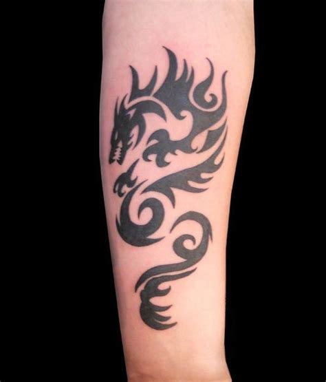cool tribal black ink dragon tattoo on forearm tattooimages