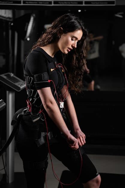 Premium Photo Girl In Ems Suit In Gym Sport Training In Electrical
