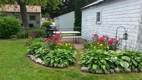 Knock Out Roses And Hosta Garden Garden Inspiration Backyard